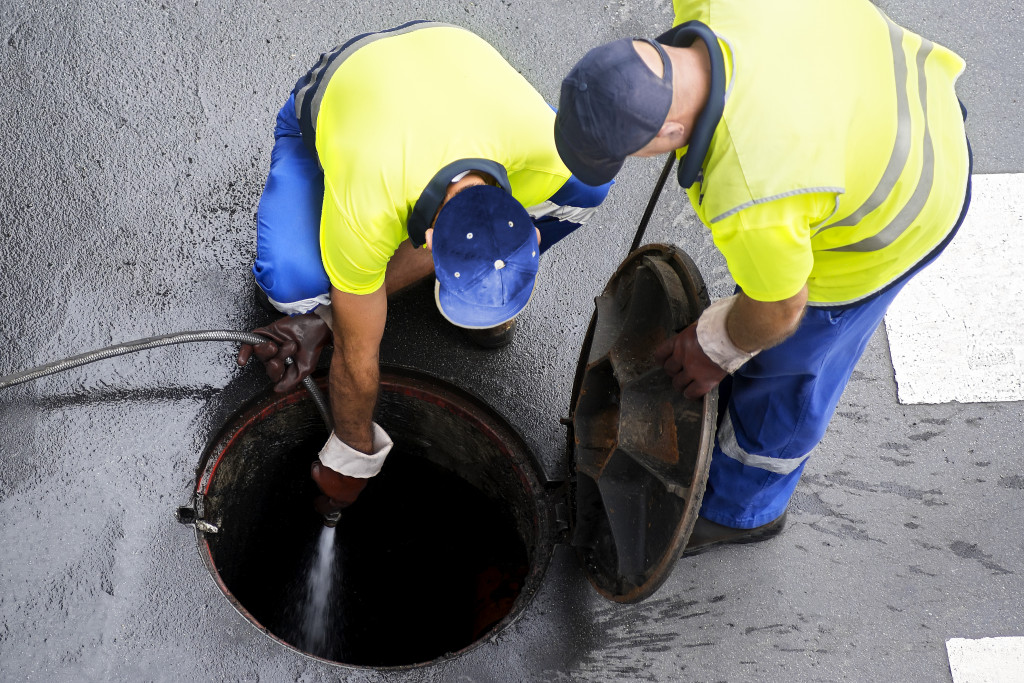man working on sewer