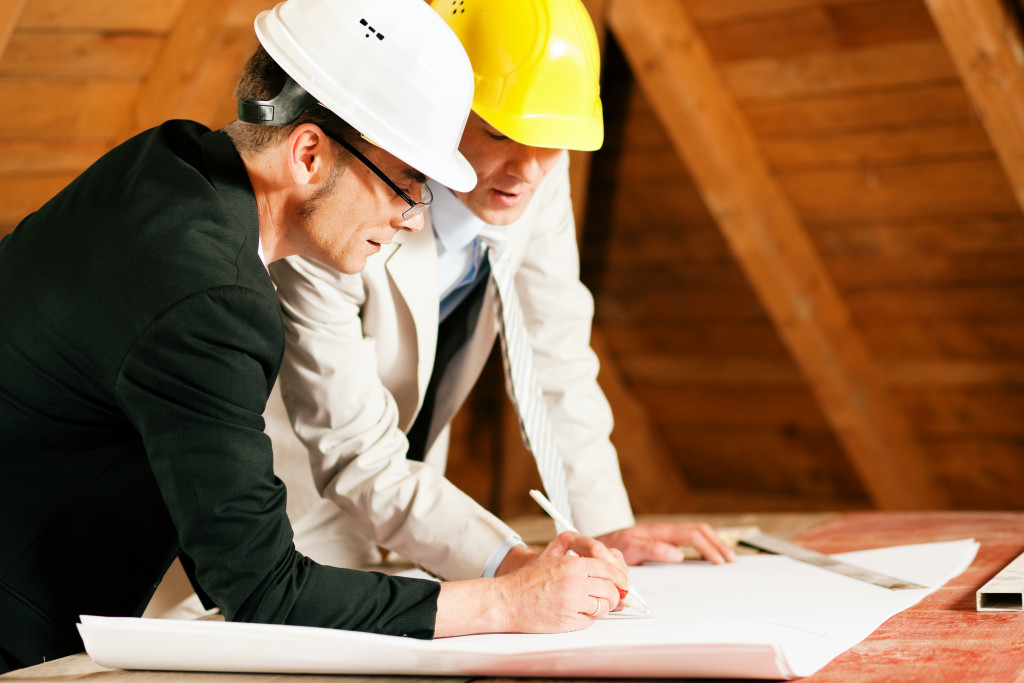 Construction workers planning an office renovation