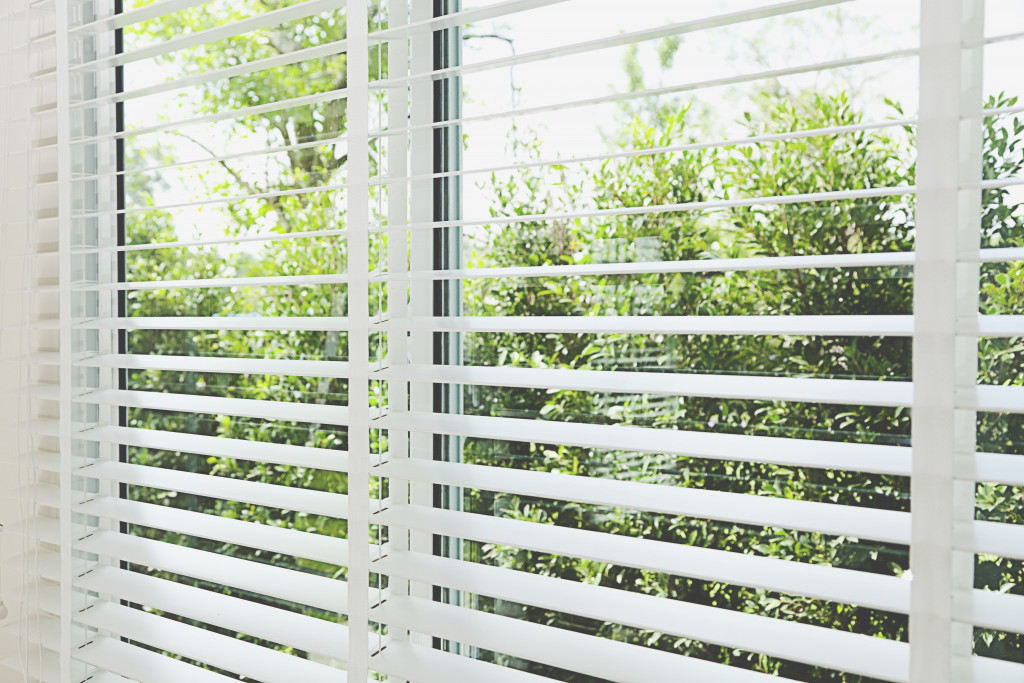 venetian blinds by window natural lighting concept