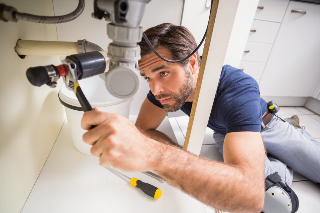 Homeowner performing maintenance