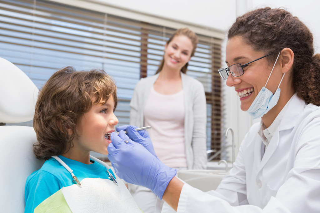 child dental patient with his mom