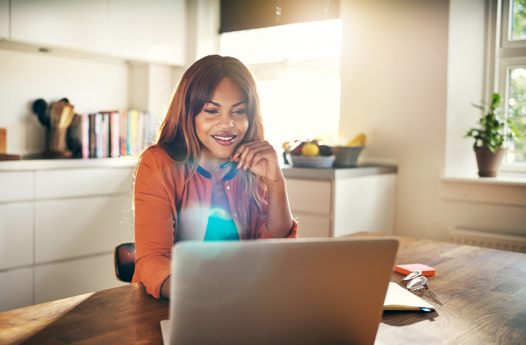 woman working at home in the kitchen counter