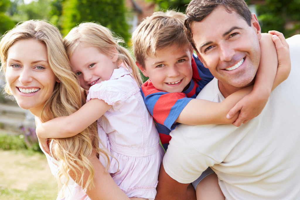 Children outdoors with parents