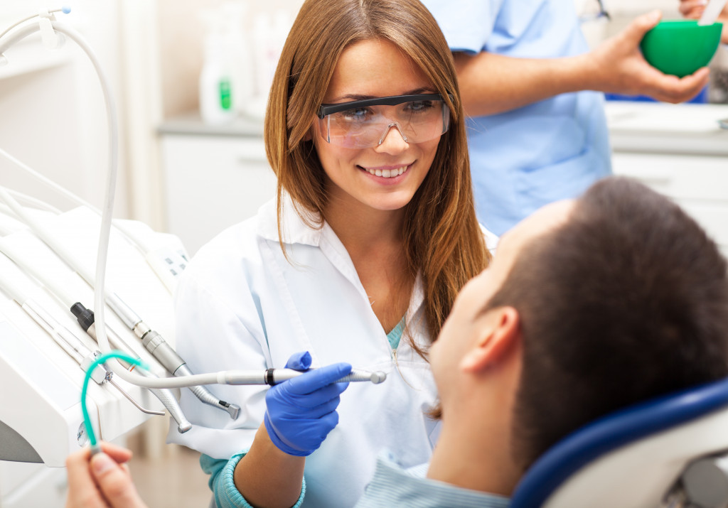 female dentist treating patient