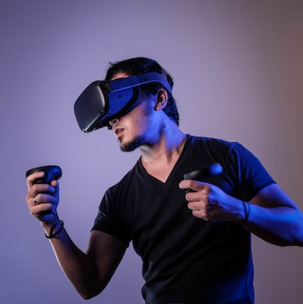 man using virtual reality in dark room