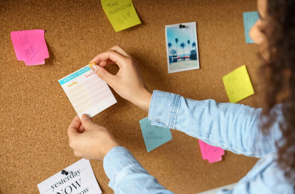 A woman organizing her board at her at-home workspace