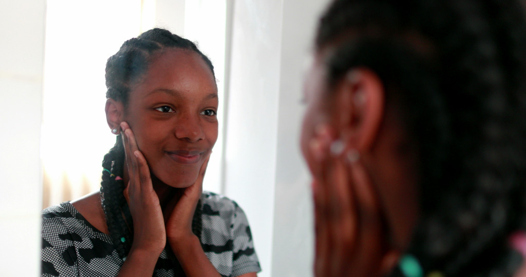 A Woman Looking at Self in the Mirror