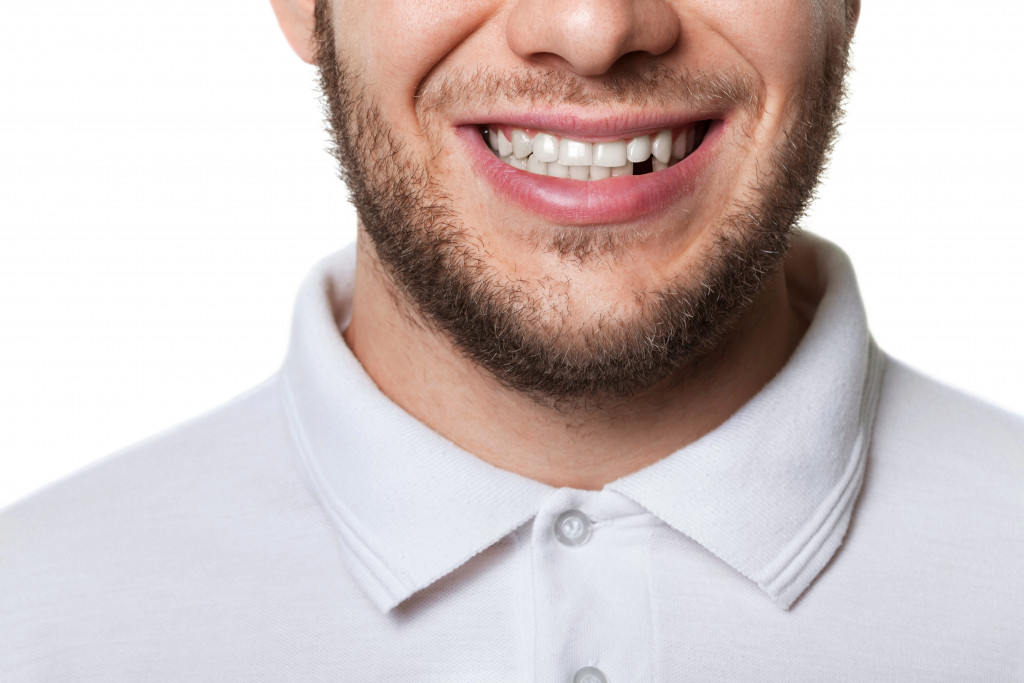 adult male with missing teeth in lower row