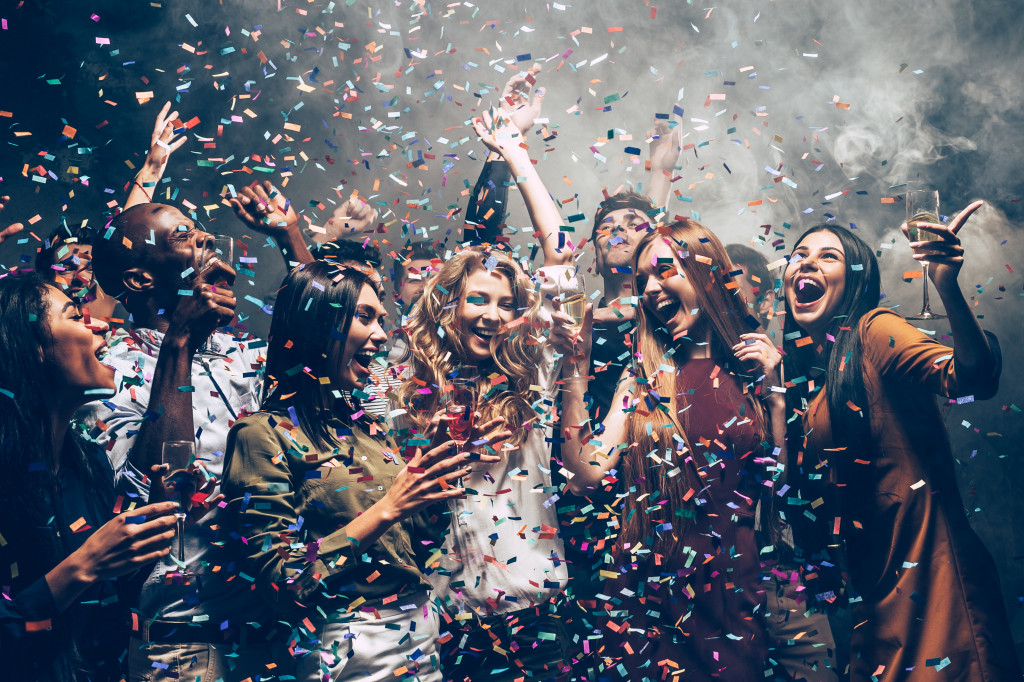 group of people having fun while dancing at a party