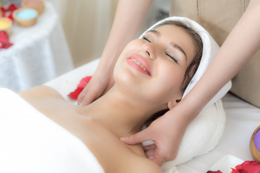 Young woman receiving a massage at a spa.