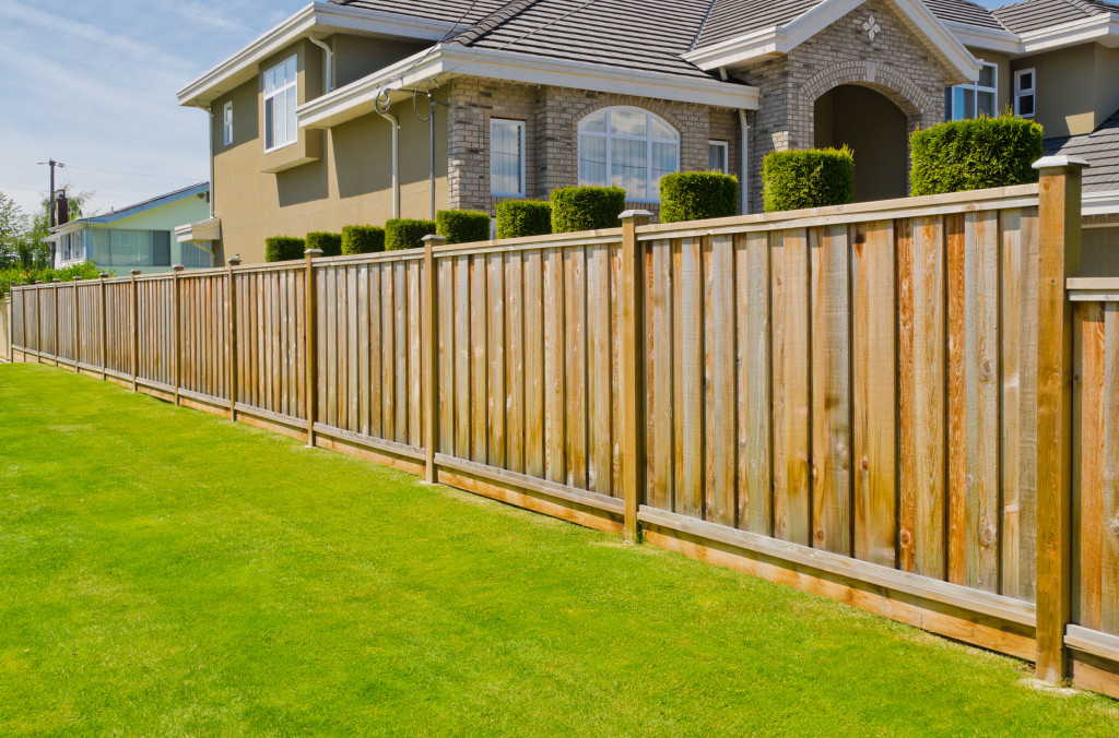 wooden fencing around a luxury house