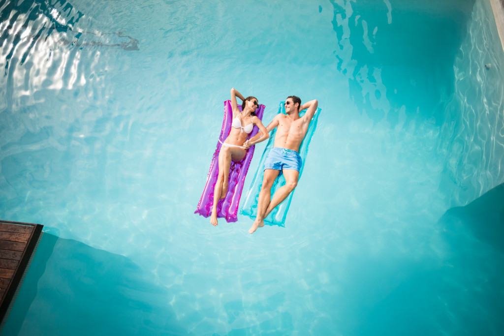 couple relaxing in the pool