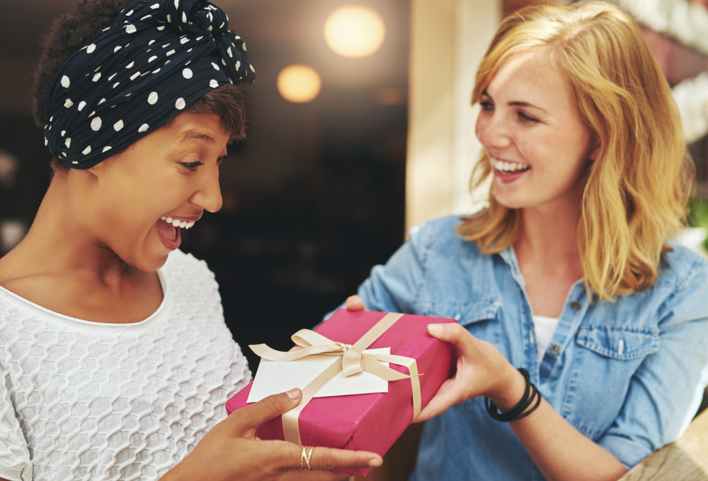 A friend giving her friend a gift