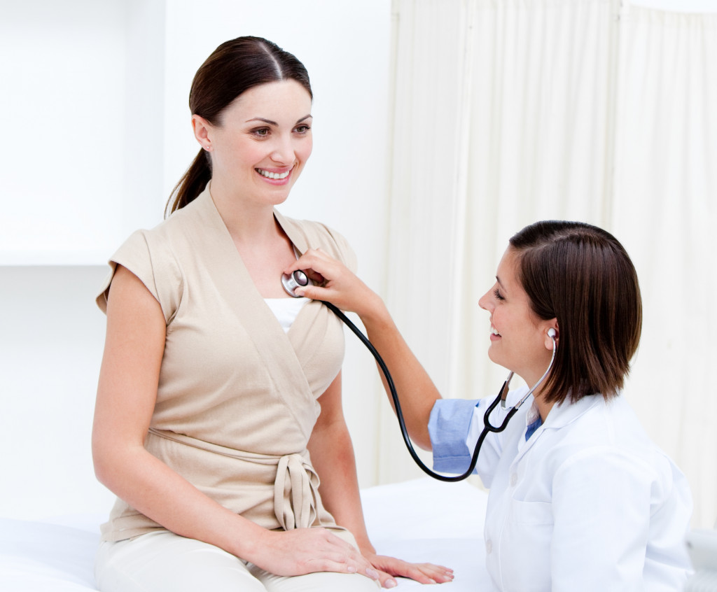 doctor checking health of a patient