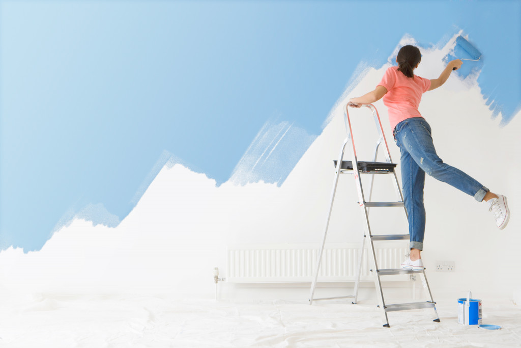 Woman painting at home