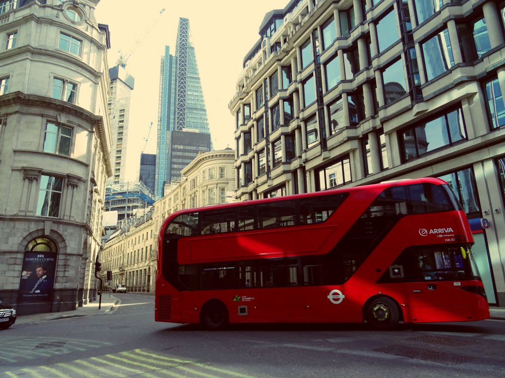 Red double-decker bus in the city